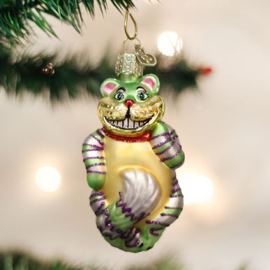 Small Cheshire Cat ornament with grinning face on white background