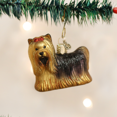 Yorkie ornament featuring a small Yorkshire Terrier dog in brown and black fur with white accents.
