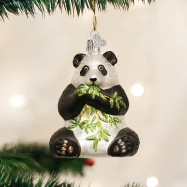 Small panda ornament with black and white fur pattern in a rounded silhouette.
