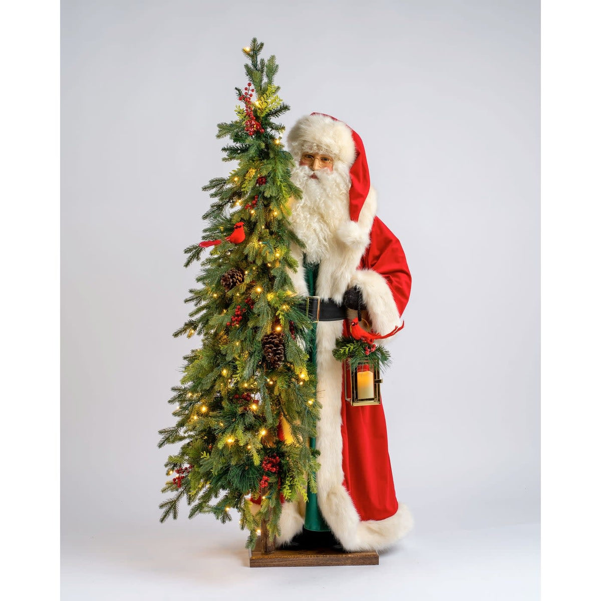 Solid wooden base supporting a lighted Christmas tree character with 200 LED lights in winter theme.