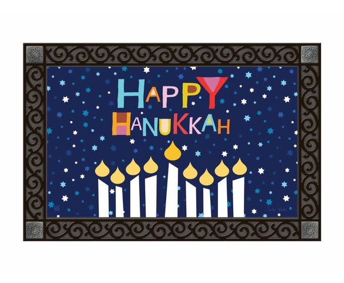 Happy Hanukkah door mat with festive holiday text on a recycled rubber backing.