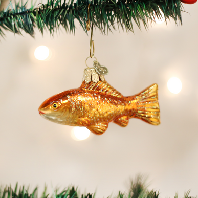 Goldfish ornament with a natural wood finish in an oval shape.