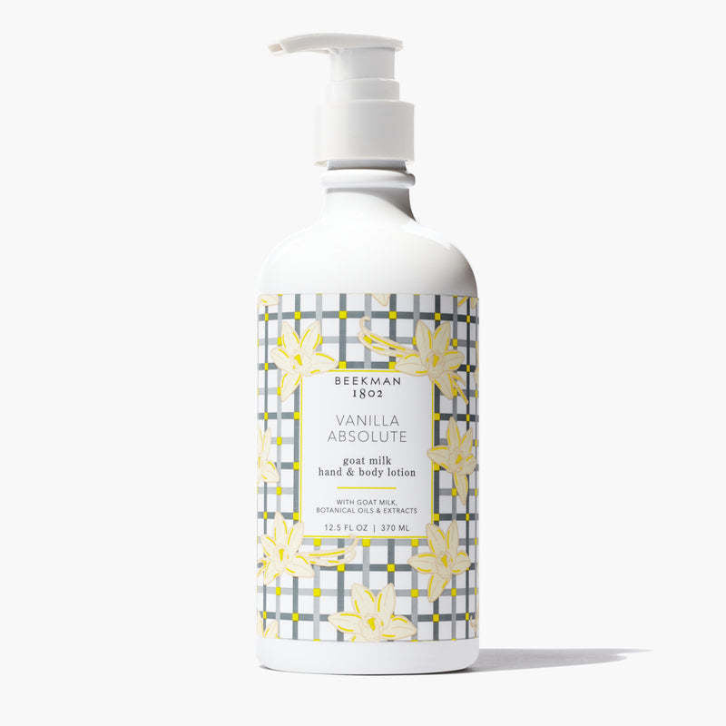 Beekman 1802 Vanilla Absolute goat milk hand and body lotion in a white pump bottle with plaid print.