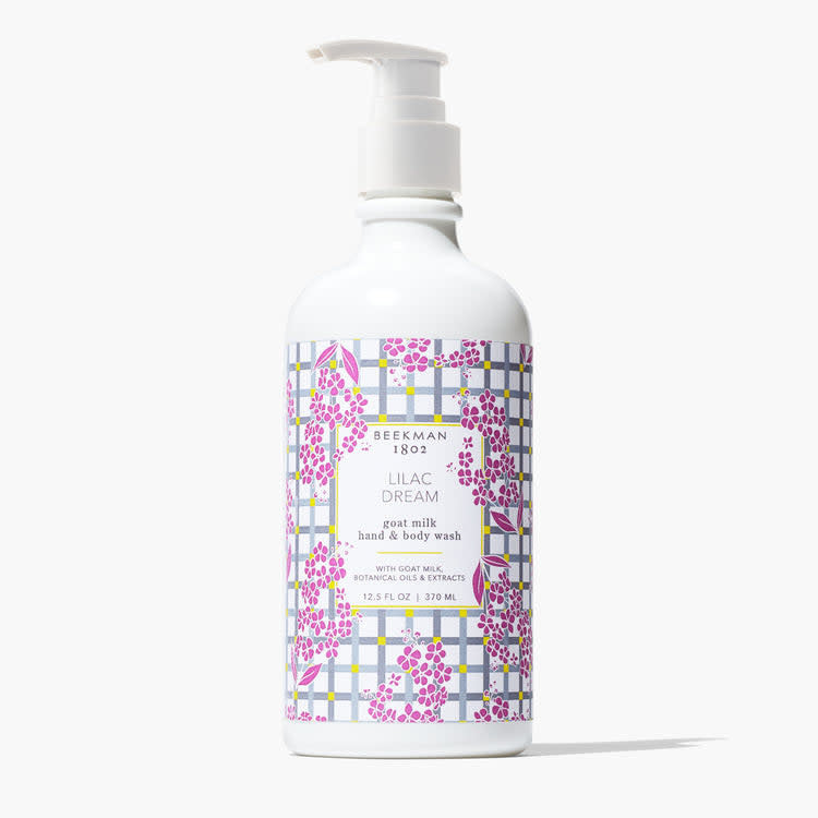 Beekman 1802 Lilac Dream goat milk hand and body wash in a white pump bottle with floral pattern.