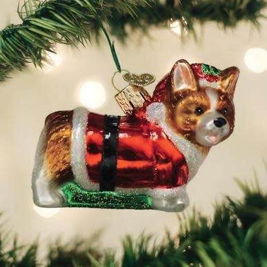 Holly Hat Corgi Puppy ornament with red hat, green holly leaves, and white snowflake details on a glossy finish.
