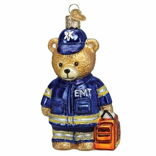 Blown glass teddy bear ornament in fire department ambulance uniform with hand-painted details and glitter accents.