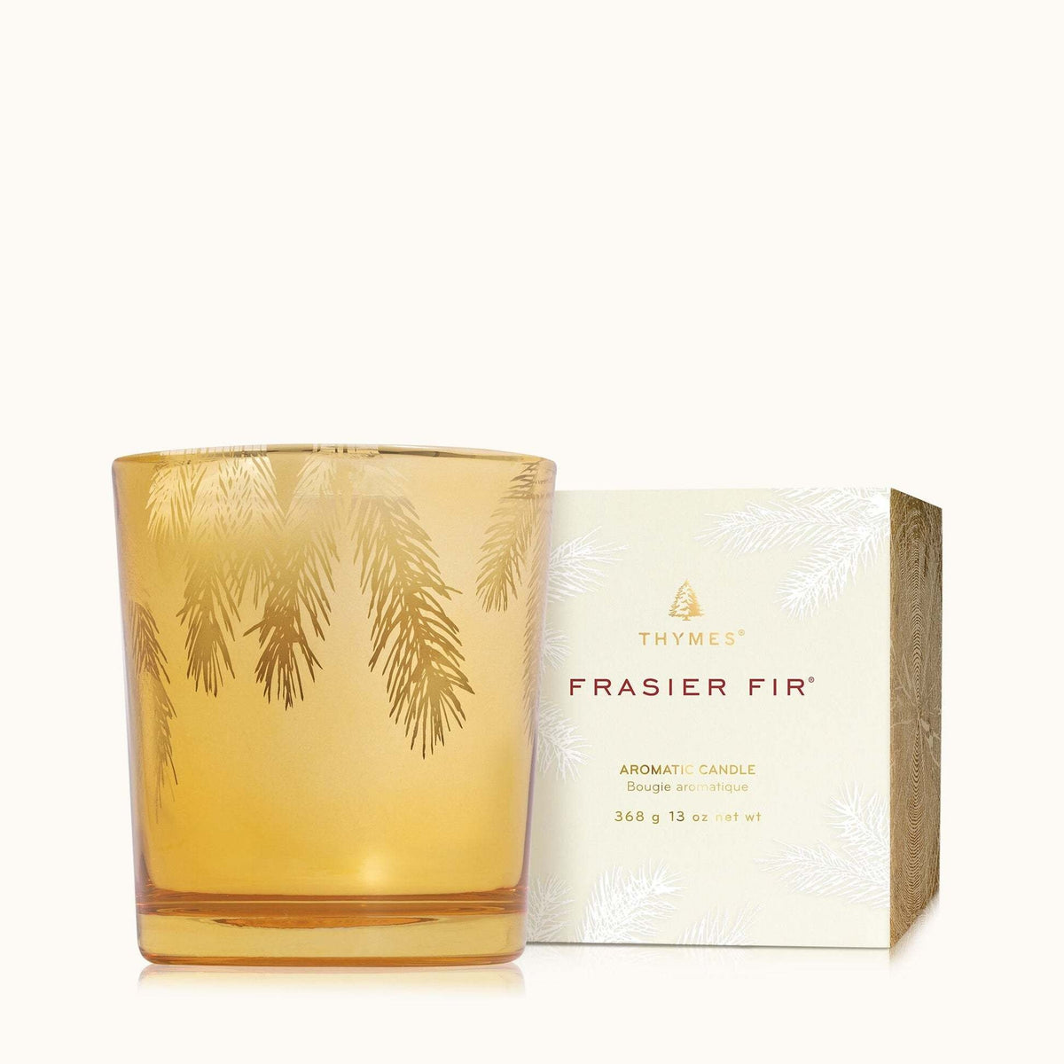 Gilded gold poured candle with etched pine needle design in Frasier Fir scent