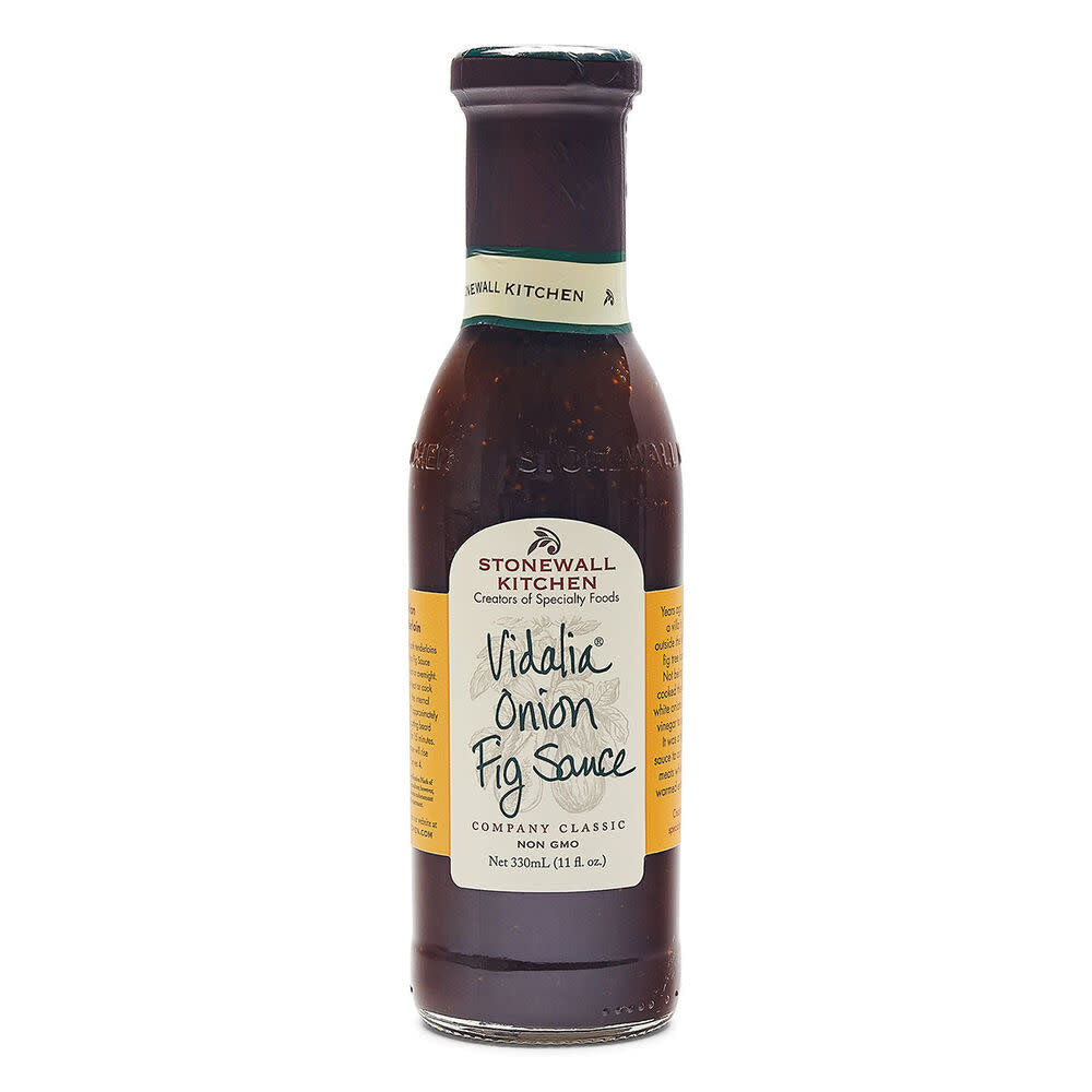 Glass jar containing Vidalia Onion Fig Sauce with a dark amber liquid.