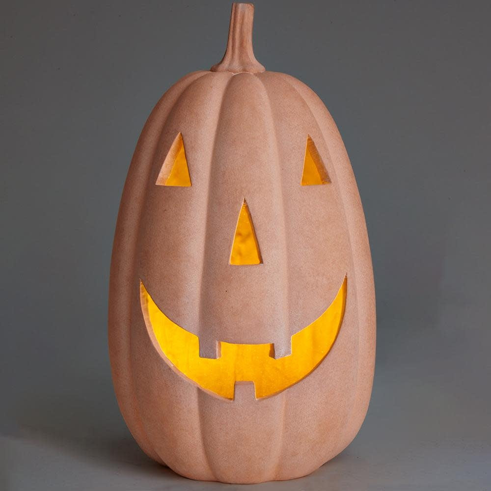 Terra cotta battery-operated jack-o'-lantern with glowing face