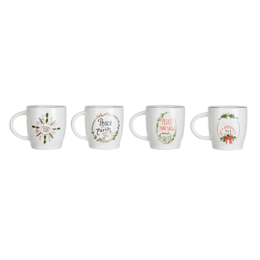 Stoneware mug with gold electroplated rim and festive holiday saying text on white background.