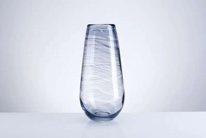 Clear glass vase with an octagonal shape measuring 8 inches wide by 15 inches tall.