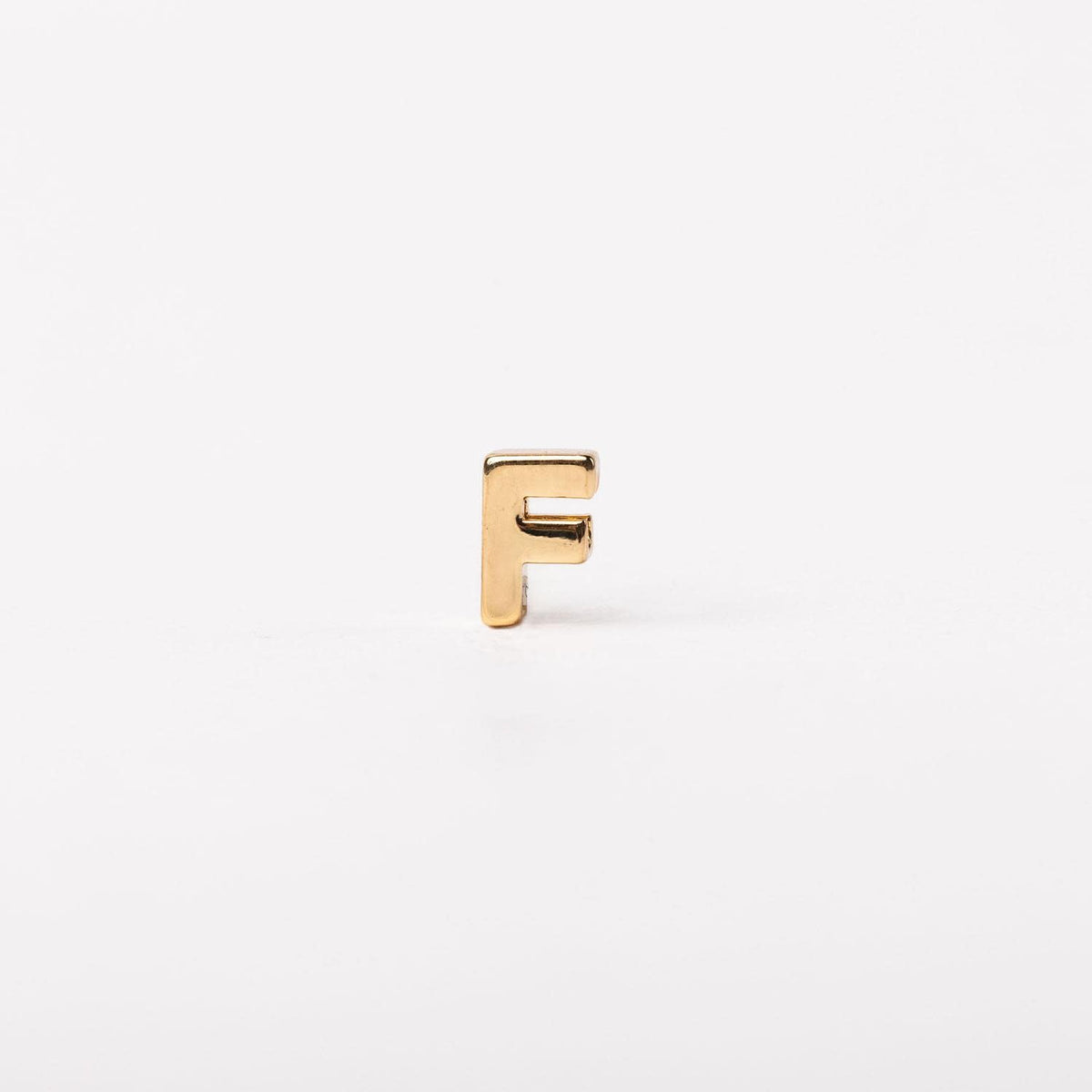 Gold-tone Charm Luxe bar necklace with a sleek rectangular pendant featuring subtle textured detailing.