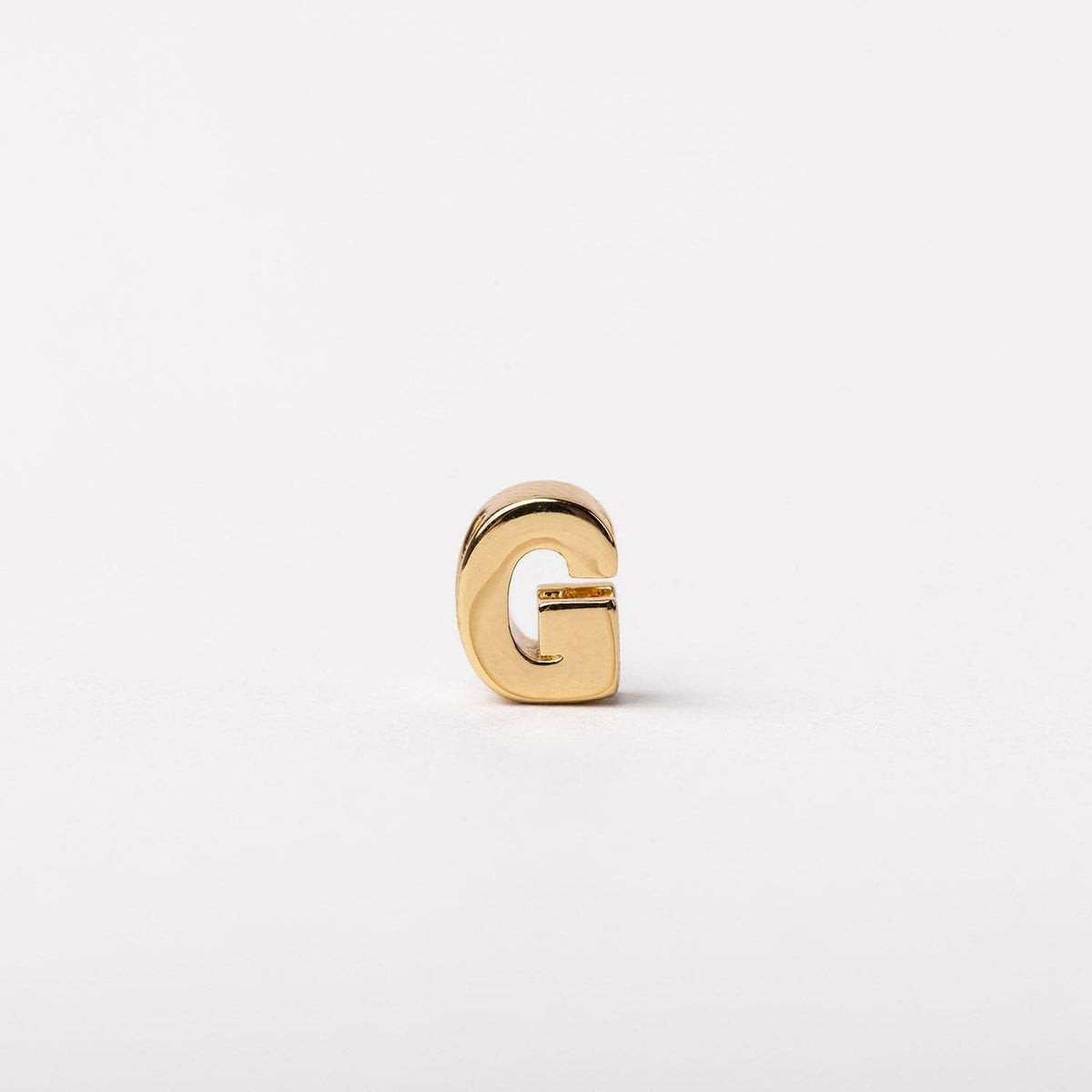 Gold-tone Charm Luxe bar necklace with a sleek rectangular pendant featuring subtle textured detailing.