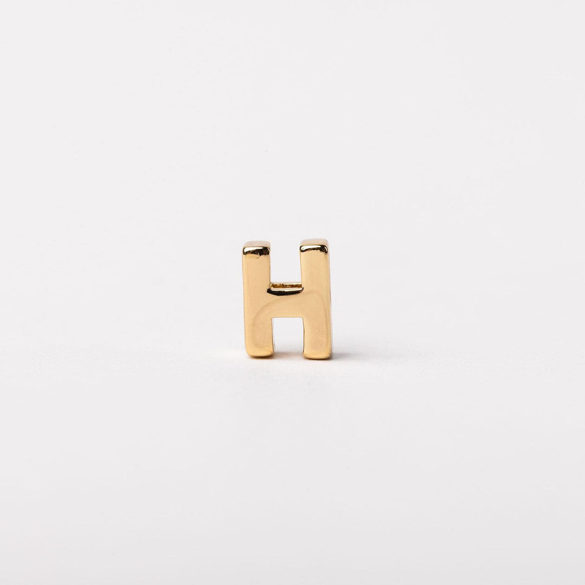 Gold-tone Charm Luxe bar necklace with delicate chain link detailing.