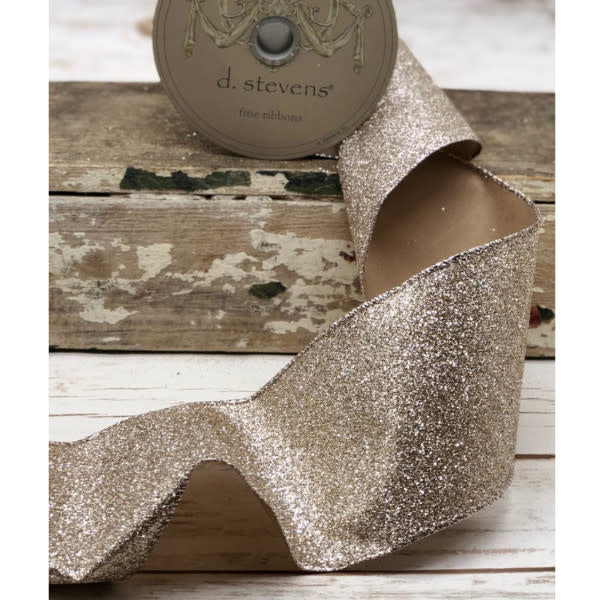 2.5-inch wide platinum glitter ribbon on a D. Stevens spool, featuring a textured metallic finish.