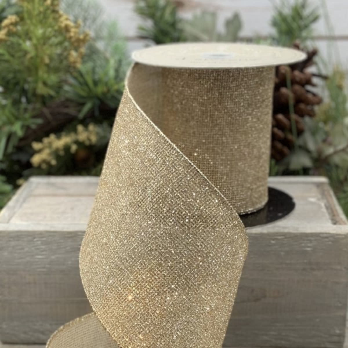 Gold glitter mesh mini square ribbon roll measuring 4 inches by 10 yards.