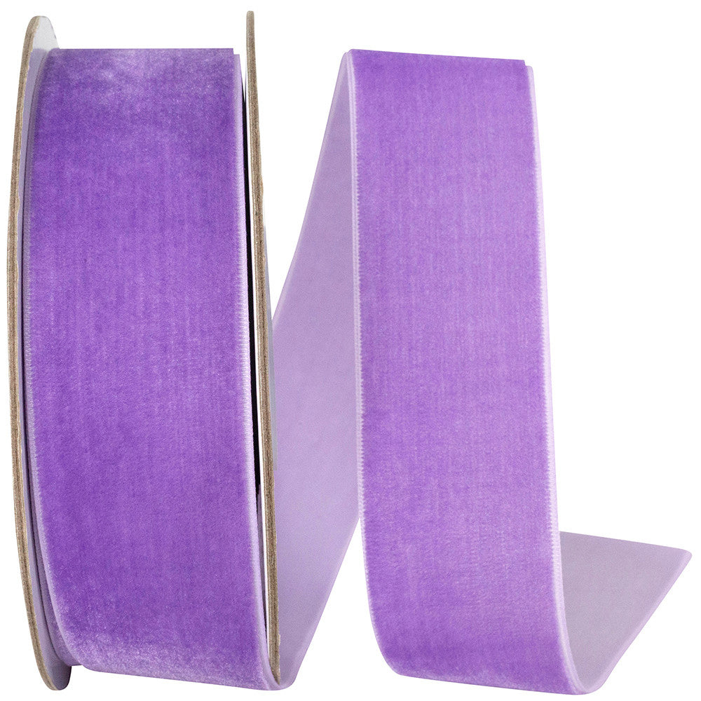 Roll of orchid-colored woven edge velvet fabric with a soft texture.
