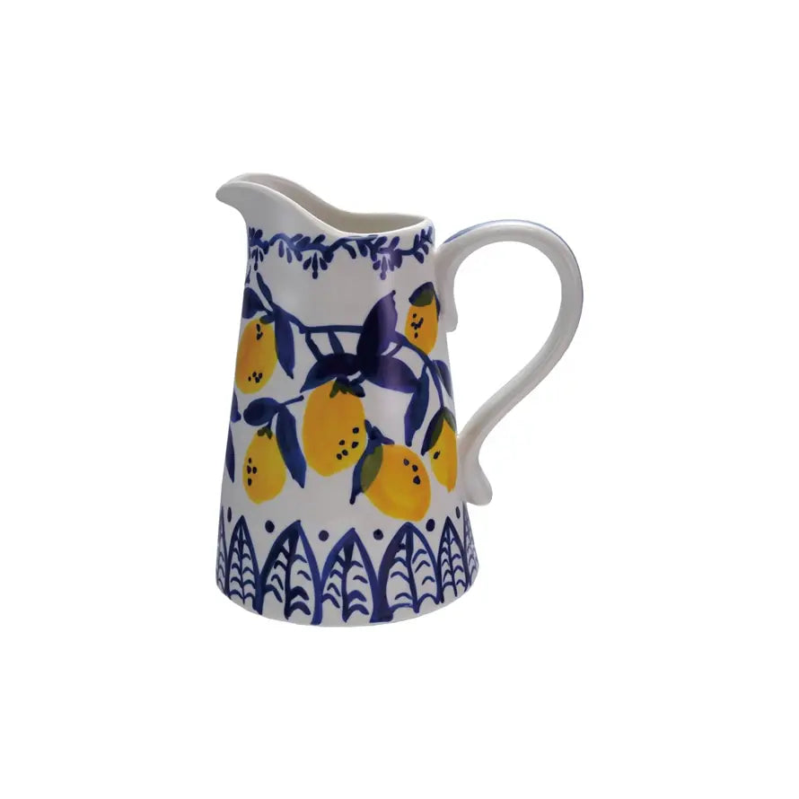 Hand-painted stoneware pitcher with intricate designs in earthy tones.