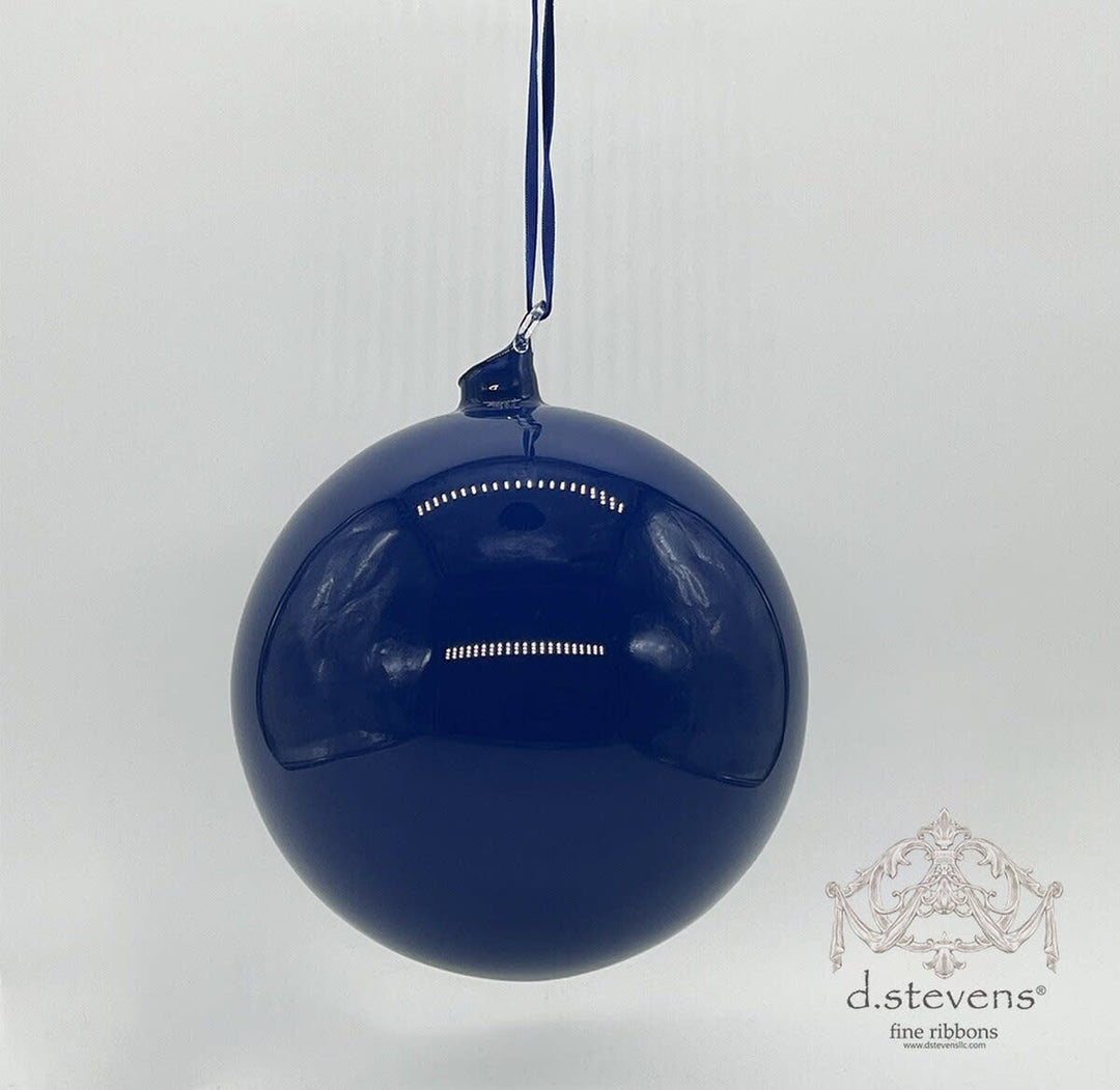 Hand-blown cobalt glass orb top with a smooth spherical shape.