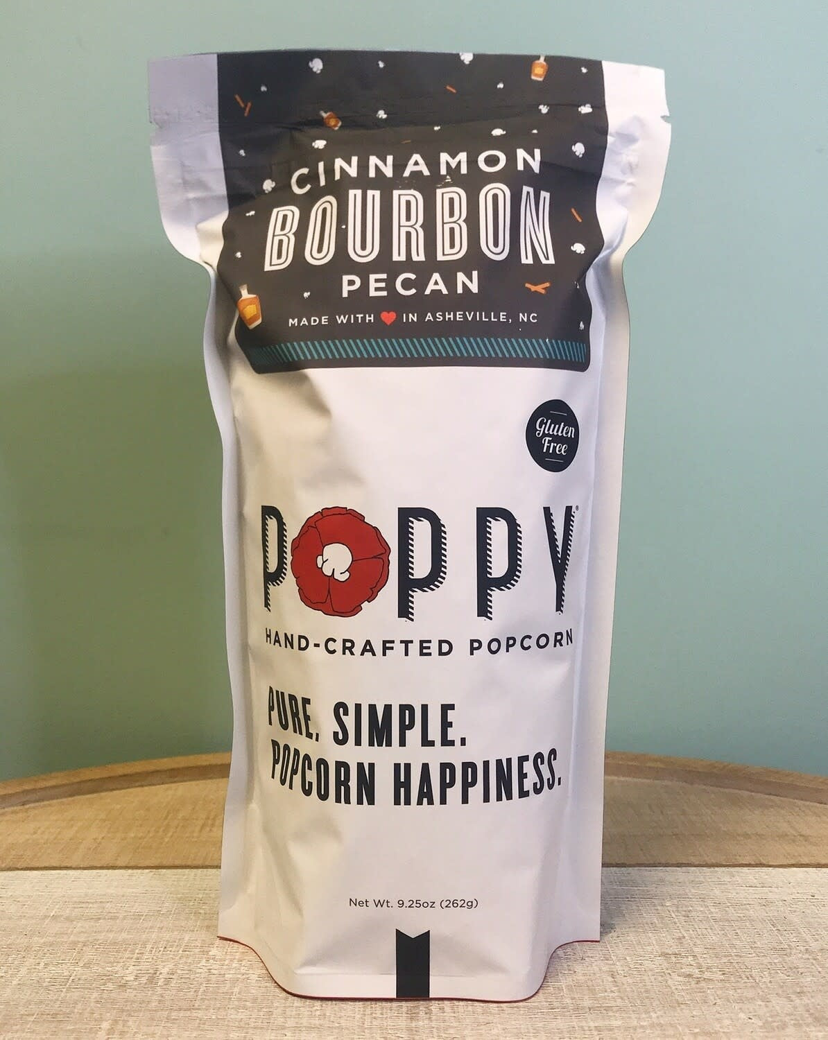 Open bag of white cheddar popcorn with dill and vinegar seasoning.