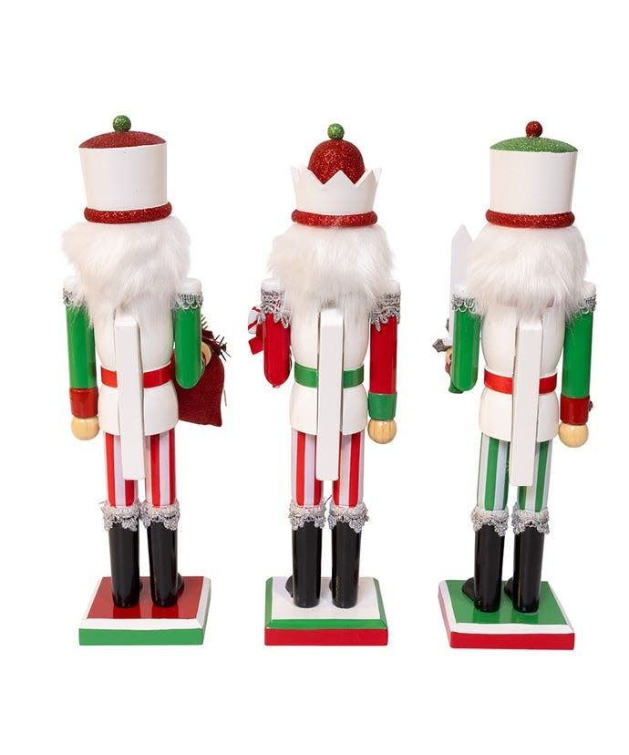 Wooden jolly nutcracker with red and green paint accents on a white background.