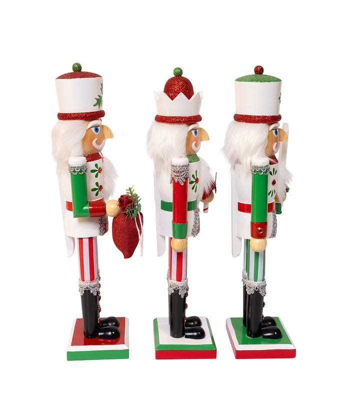 Side view of a 15-inch wooden nutcracker with red and green painted finish.