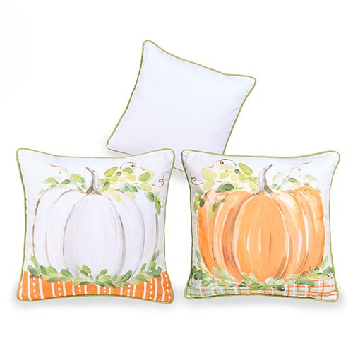 Square cotton pillow with a harvest pumpkin print in orange tones on a neutral background.