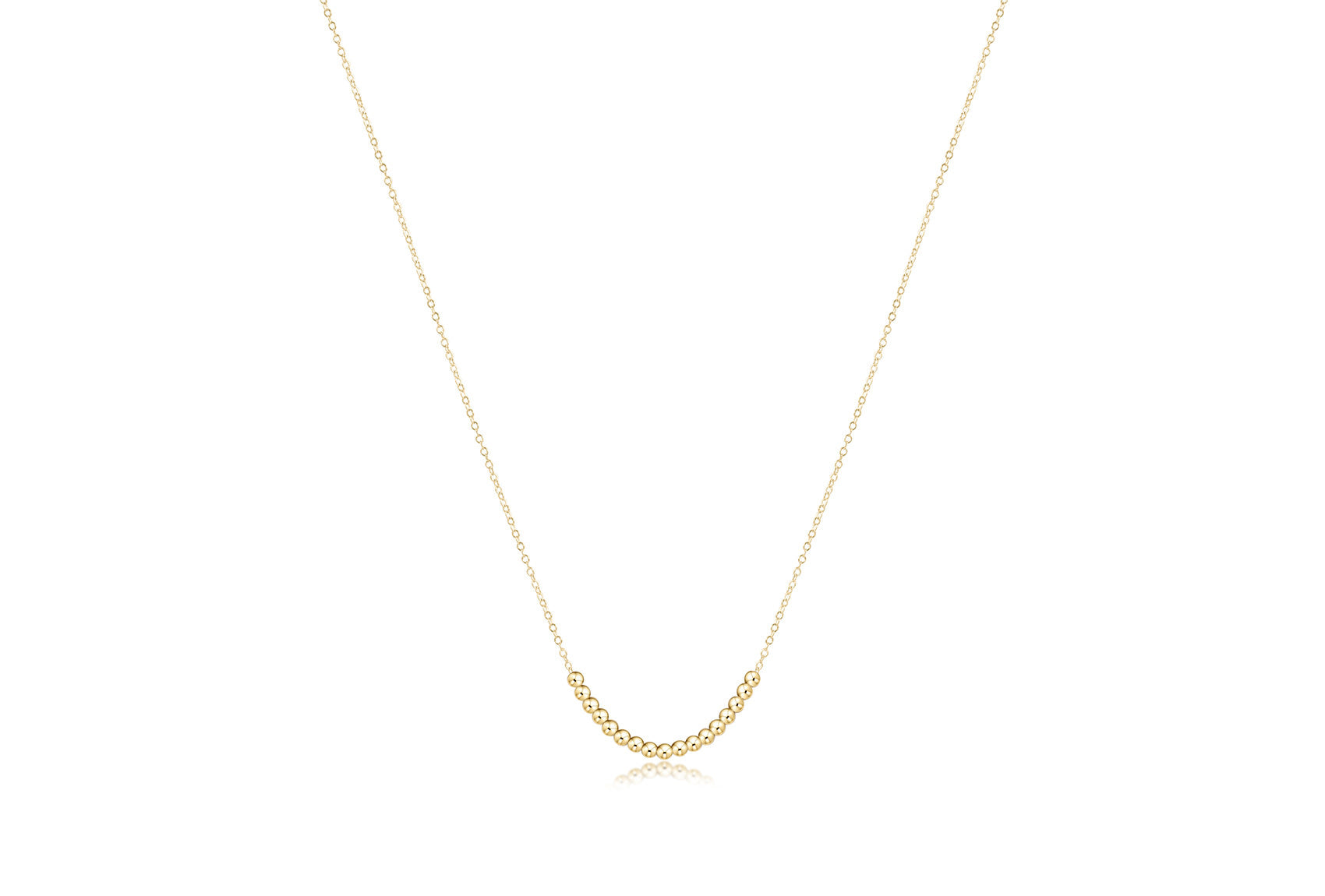 Gold classic beaded necklace with a clarity charm pendant on an adjustable chain.