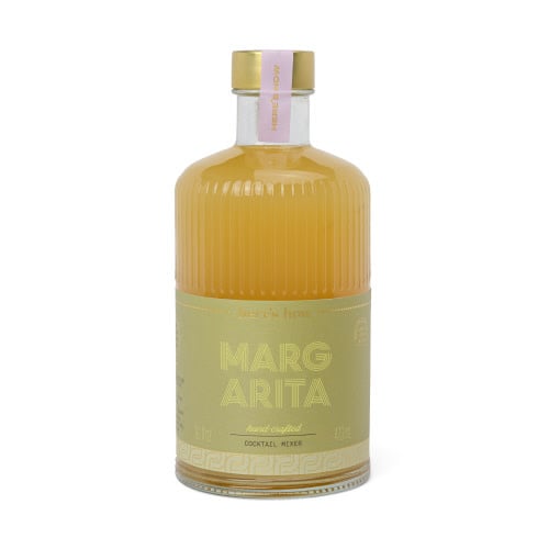 Fluted glass bottle with gold foil label containing margarita cocktail mixer