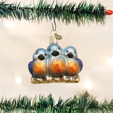 Feathered Friends ornament: glass bird with natural feather texture in earthy tones.