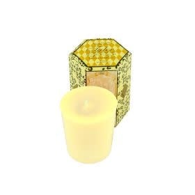 Single white votive candle in Pineapple Crush fragrance with a smooth cylindrical silhouette.