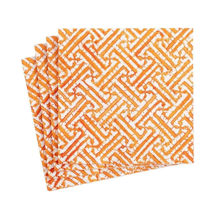 Orange triple-ply cocktail napkins featuring an intricate fretwork lace-like pattern.