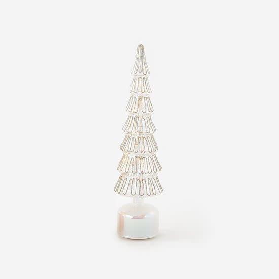 Rotating glass tree with vibrant lights on a stand