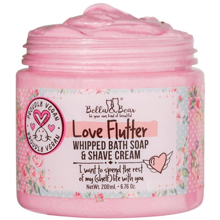 White tub of whipped bath soap and shave cream with plant-based ingredients.