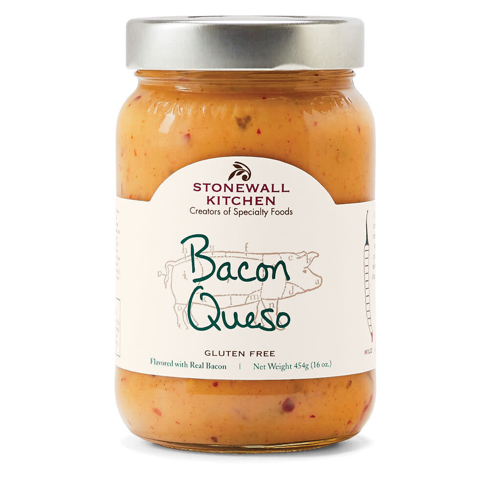 Open jar of creamy bacon queso dip with visible red peppers in a clear container