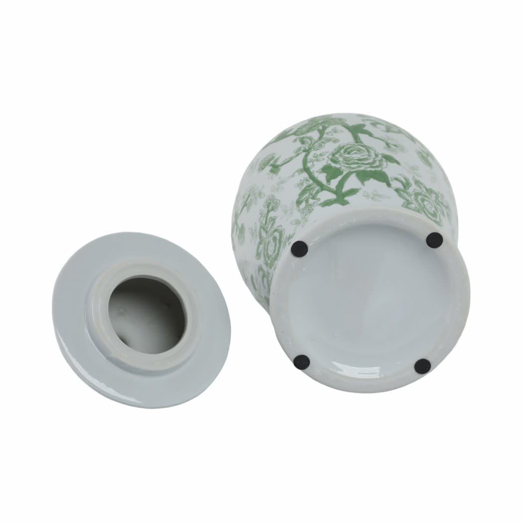 Underside of a green and white ceramic temple jar with lid, showing four black protective pads.