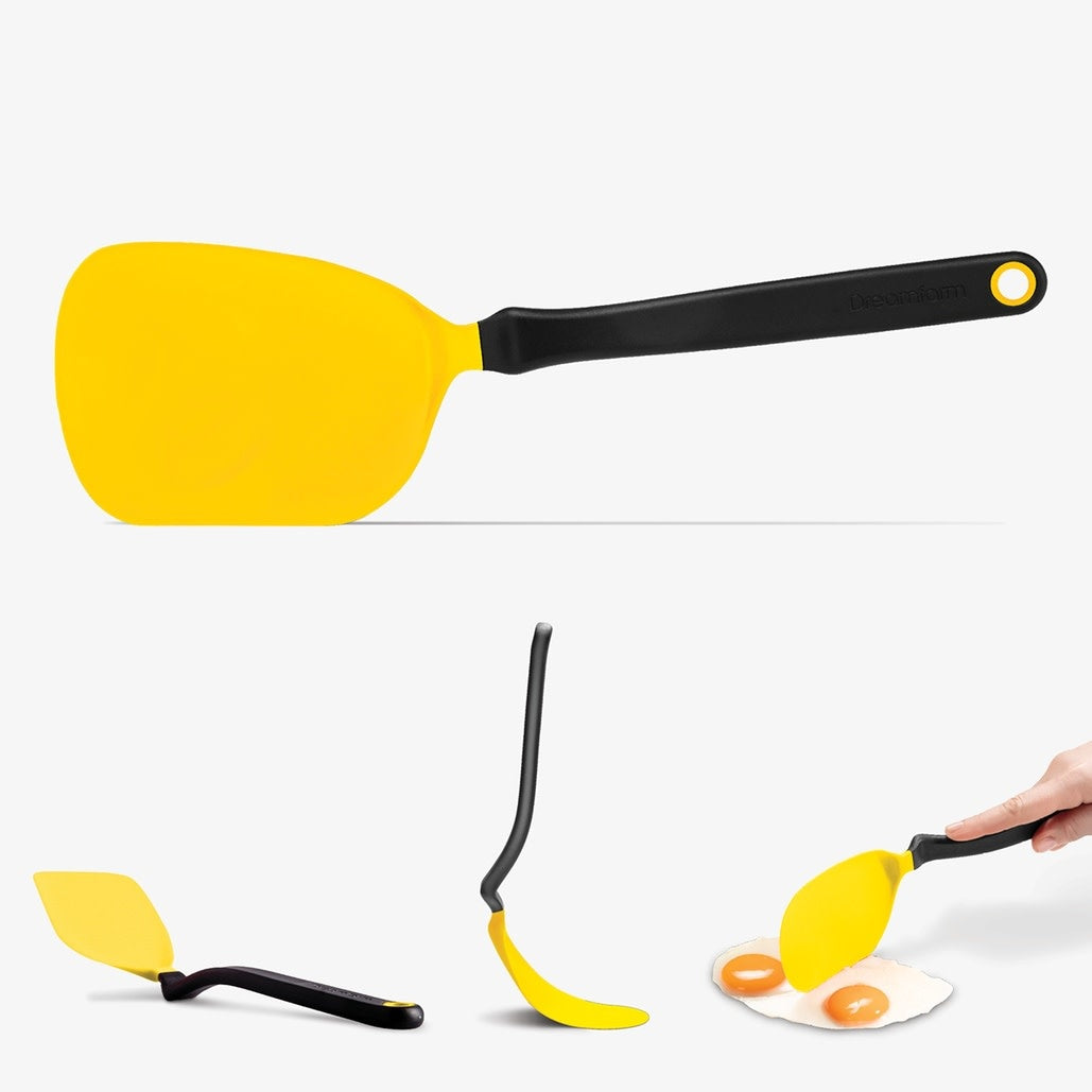 Chopula spatula with thin flexible nylon head in black designed for flipping and chopping.