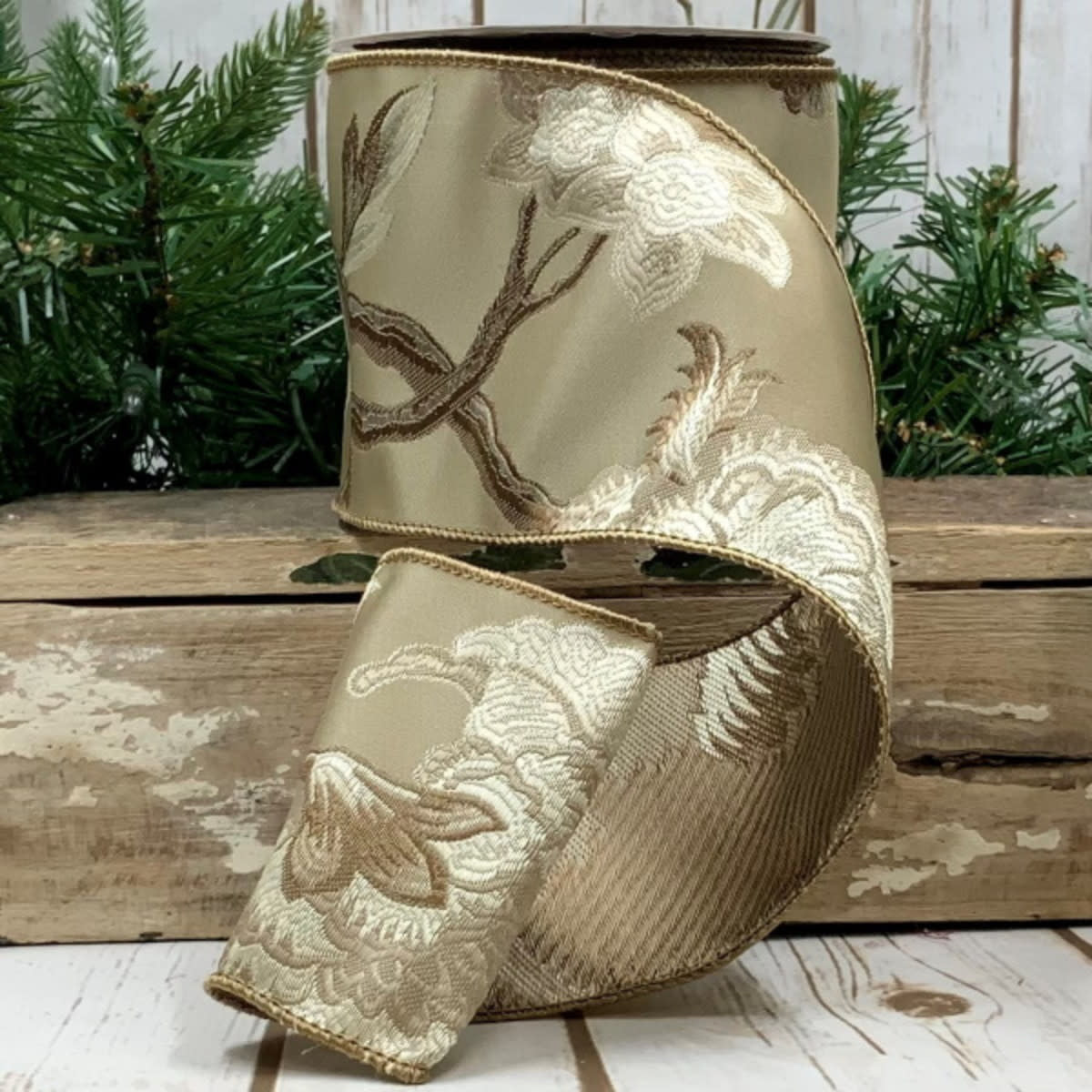 Brown and beige floral jacquard fabric roll with a subtle woven pattern.