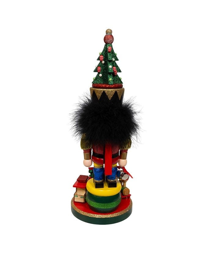 Wooden Hollywood nutcracker with train base in festive attire featuring a tall Christmas tree hat.