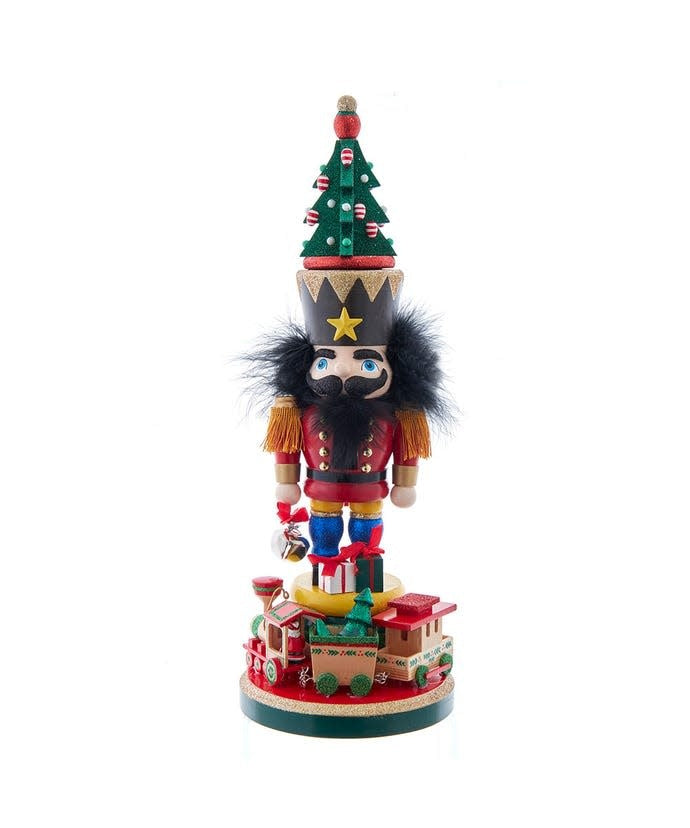 Wooden Hollywood nutcracker with toy train base in festive attire