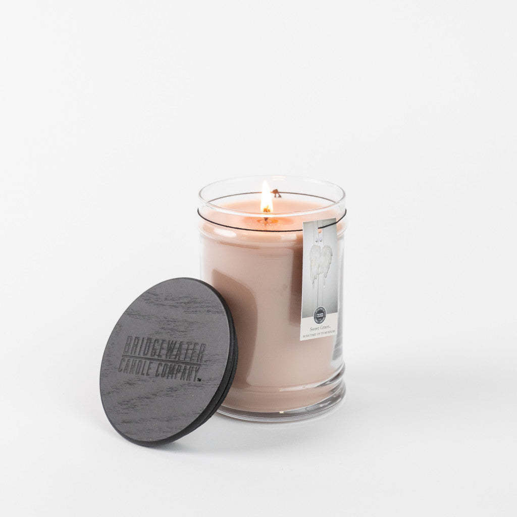 Large glass jar candle with white soy-blend wax featuring the Sweet Grace fragrance.