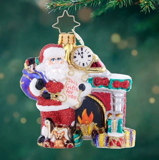 3-inch square wooden Santa Gem ornament featuring a red suit with white trim holding an open list.