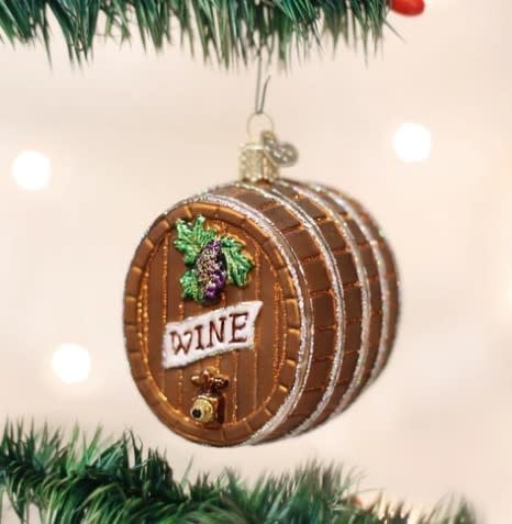 3-inch wine barrel ornament with natural wood grain texture and curved stave silhouette.
