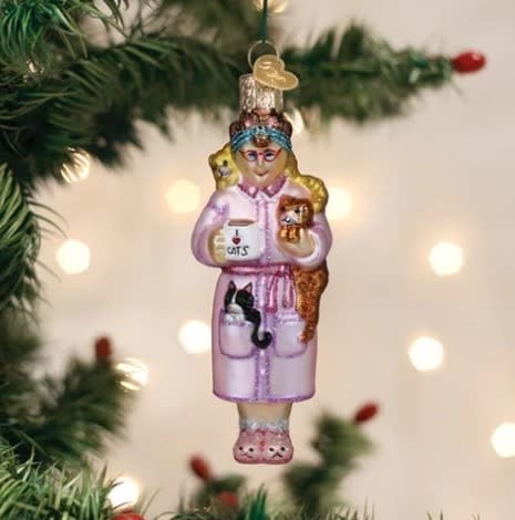 Cat Lady Ornament figurine showing a woman with two cats in neutral tones.