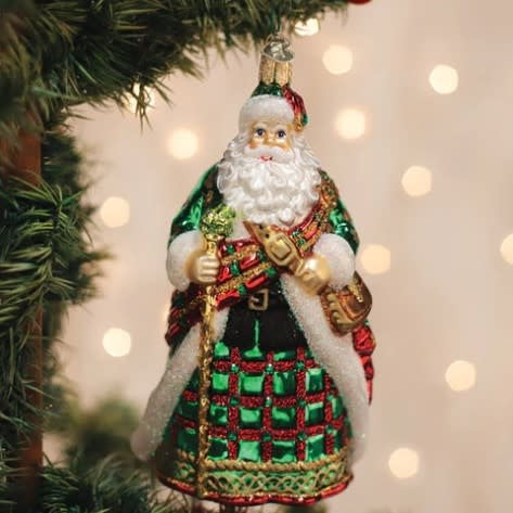 Hand-crafted Irish Father Christmas ornament with red suit, white beard, green hat, and gold trim.