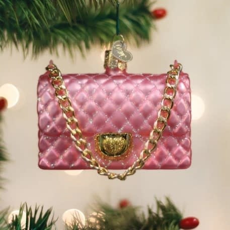 Quilted purse ornament in a neutral tone with stitched texture.
