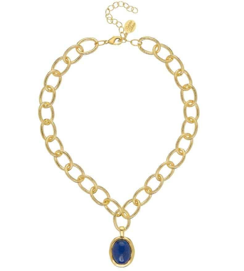 Caroline necklace with blue lapis cabochon in gold setting on a toggle chain