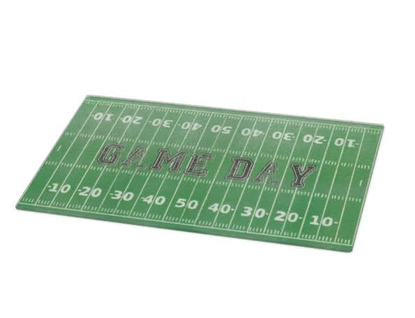 Small green cutting board with white football field grid lines.