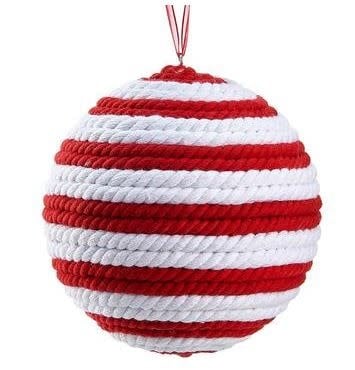 Red knitted ball ornament with white accents made from cotton and polyfoam string.