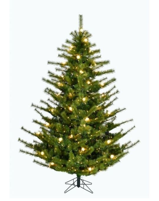 A 9-foot artificial Christmas tree with green needles and warm LED lights on a metal stand.